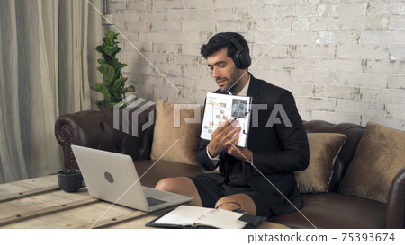 Portrait of smiling business, middle east CEO man working from home and talking to colleagues in webcam group video call conference on internet online on laptop computer notebook device in quarantine. Portrait of smiling business, middle east CEO man working from home and talking to colleagues in webcam group video call conference on internet online on laptop computer notebook device in quarantine. 75393674