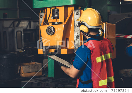 Skillful factory worker or engineer do machine job in manufacturing workshop Skillful factory worker or engineer do machine job in manufacturing workshop 75397234