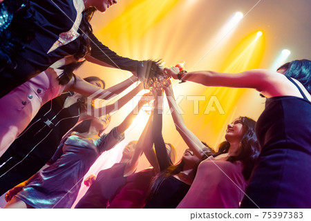 Young people celebrating a party, drink and dance Young people celebrating a party, drink and dance 75397383
