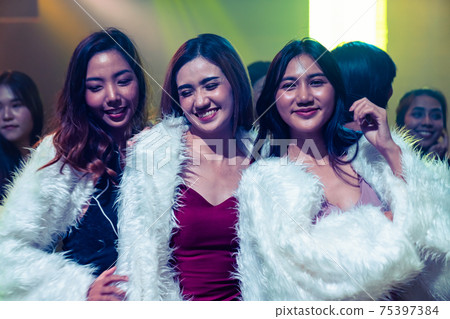 Group of women friend having fun at party in dancing club Group of women friend having fun at party in dancing club 75397384