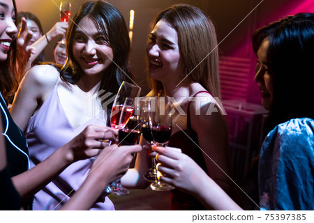 Young people celebrating a party, drink and dance Young people celebrating a party, drink and dance 75397385