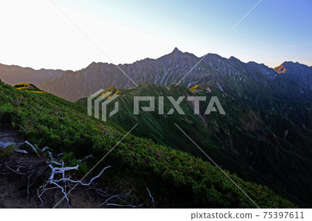 Mountains seen from Nishi-Kamaone leading to Mt. Yari in the Northern Alps Mountains seen from Nishi-Kamaone leading to Mt. Yari in the Northern Alps 75397611