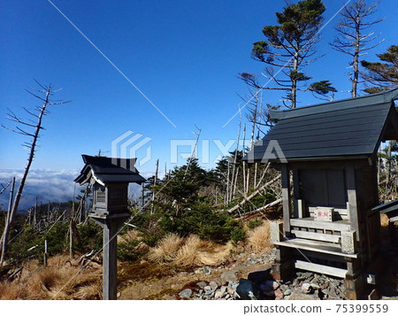 Blue sky and shrine at the summit of Mt. Omine Blue sky and shrine at the summit of Mt. Omine 75399559
