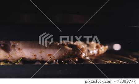 Delicious juicy meat steak cooking on the grill. Cook grilling fresh chicken breast. Fry chicken fillet on electric roaster. Slow motion. 75399777