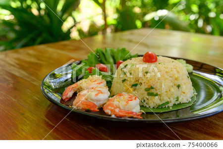 Fried rice with shrimp on black dish Fried rice with shrimp on black dish 75400066