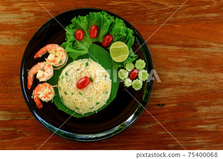 Top view of fried rice with shrimp on black dish Top view of fried rice with shrimp on black dish 75400068