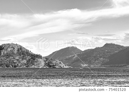 Scenery view of rocky slope over the lake in black and white 75401520