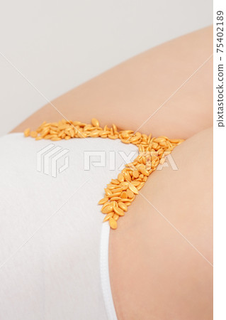 Wax beans lying down on bikini zone Wax beans lying down on bikini zone 75402189