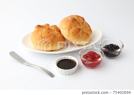 Butter roll bread jam on a plate white background Butter roll bread jam on a plate white background 75402694