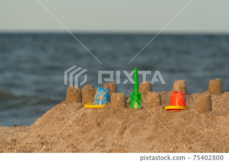 Sand castle on the beach. Fun for children at sea. Sand castle on the beach. Fun for children at sea. 75402800