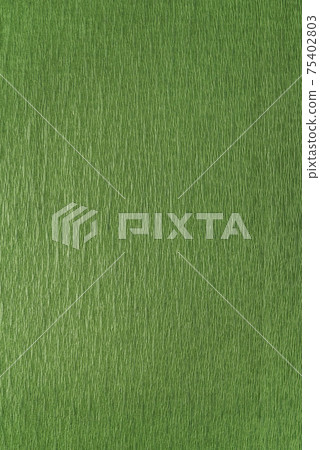 Green wrapping paper close-up. Green textured background. Vertical frame Green wrapping paper close-up. Green textured background. Vertical frame 75402803