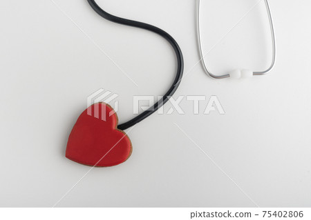 Red heart and stethoscope, white background. Follow your heart. Health concept. Red heart and stethoscope, white background. Follow your heart. Health concept. 75402806