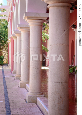 A row of columns in a mexican hacienda. A row of columns in a mexican hacienda. 75404329