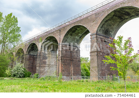 Railway viaduct at Reddish Vale, Stockport, Cheshire, UK. 75404461