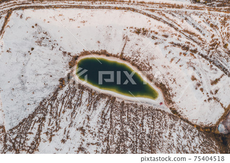 A lake formed on phosphogypsum waste, a tourist find in Ukraine, white mountains from phosphate waste. A lake formed on phosphogypsum waste, a tourist find in Ukraine, white mountains from phosphate waste. 75404518