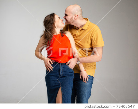White young man and woman isolated on gray White young man and woman isolated on gray 75405547