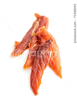 Dried chicken meat. Tasty jerky meat. Dried chicken meat. Tasty jerky meat. 75406091