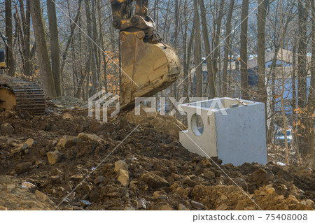 Drainage system on square concrete manholes are installed at constructed for draining stormwater on main road construction Drainage system on square concrete manholes are installed at constructed for draining stormwater on main road construction 75408008