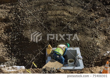 Assembling drainage system, rectangular drainage pipes holes on the concrete in the residential area of the urban road Assembling drainage system, rectangular drainage pipes holes on the concrete in the residential area of the urban road 75408301