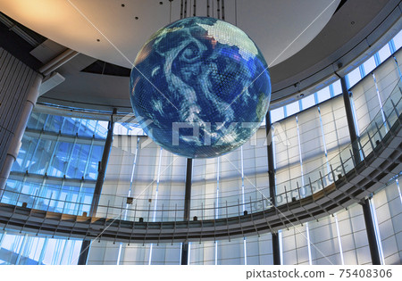 [Odaiba, Tokyo] An earth-shaped Geo-Cosmos suspended from the Future Science Museum seen from a low angle. 75408306