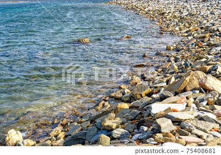 Stony beach in Delos island - Greece 75408681