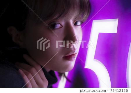 Woman illuminated by neon Woman illuminated by neon 75412136