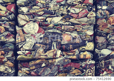 A collection of crushed cans for recycling 75412690
