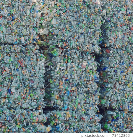 A pile of PET bottles piled up in a recycling facility A pile of PET bottles piled up in a recycling facility 75412863
