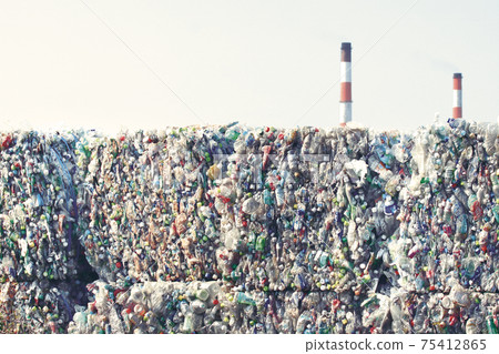 A pile of PET bottles piled up in a recycling facility 75412865