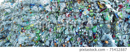 A pile of PET bottles piled up in a recycling facility A pile of PET bottles piled up in a recycling facility 75412887