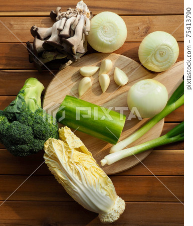 Fresh organic vegetables mushrooms, zucchini, garlic and green onions Fresh organic vegetables mushrooms, zucchini, garlic and green onions 75413790