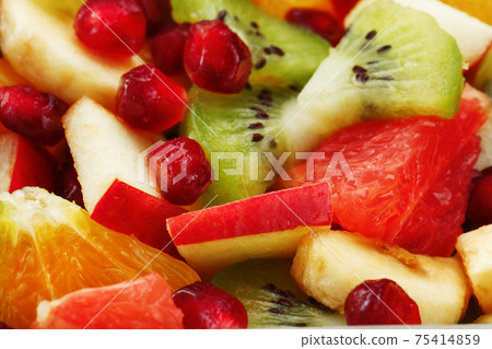 Pieces of raznfh fruit close-up in full screen, Fruit salad. 75414859