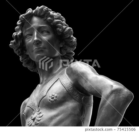 David killer of Goliath ancient statue. Biblical story. Antique sculpture of young man in armor isolated on black background 75415506
