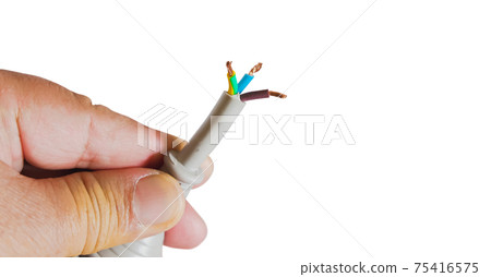Human hand hold a damage electricity wire on white background. Human hand hold a damage electricity wire on white background. 75416575
