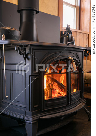 Wood-burning stove, fireplace, beautiful flames 75418048