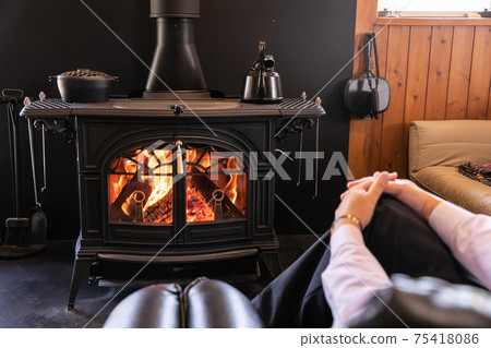 Wood-burning stove, fireplace, beautiful flames 75418086