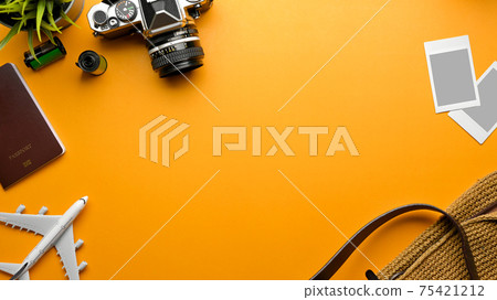 Travel concept, mock up creative scene with passport, camera, photo card frame, bag and copy space Travel concept, mock up creative scene with passport, camera, photo card frame, bag and copy space 75421212