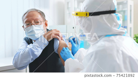 nurse making COVID19 vaccination 75421892
