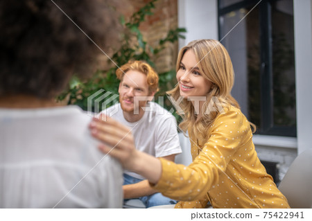 Group members supporting each other and looking friendly Group members supporting each other and looking friendly 75422941