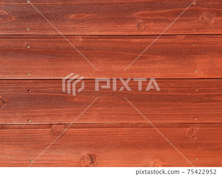 Background image of screwed reddish brown wood board 75422952