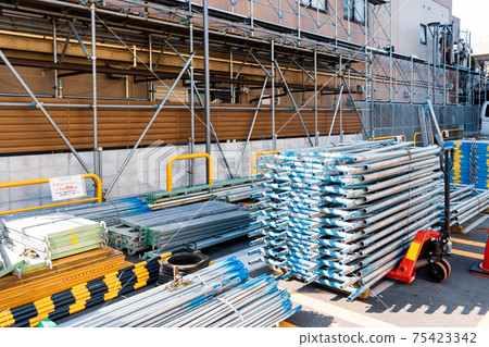 Building renovation work: A neatly organized material storage area 75423342