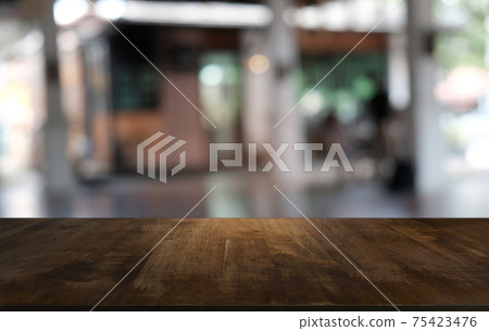 Empty dark wooden table in front of abstract blurred bokeh background of restaurant . can be used for display or montage your products.Mock up for space. Empty dark wooden table in front of abstract blurred bokeh background of restaurant . can be used for display or montage your products.Mock up for space. 75423476