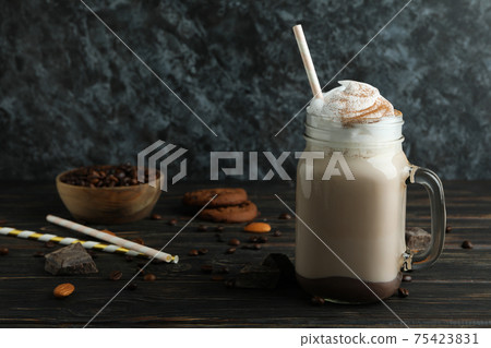 Concept of delicious food with chocolate milkshake on wooden table 75423831