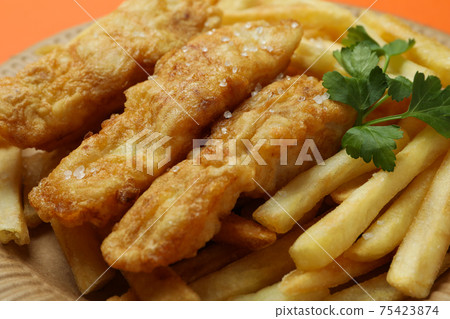 Plate with fried fish and chips, close up Plate with fried fish and chips, close up 75423874