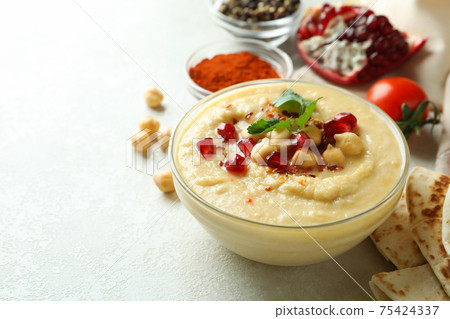 Concept of cooking hummus on white textured background Concept of cooking hummus on white textured background 75424337