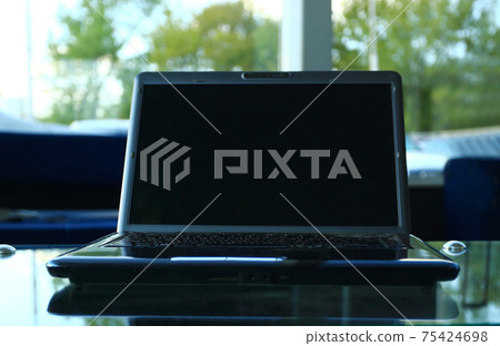 Closeup photo of laptop computer with open top. Blank screen 75424698