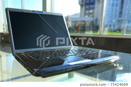 Closeup photo of laptop computer with open top. Blank screen. 75424699