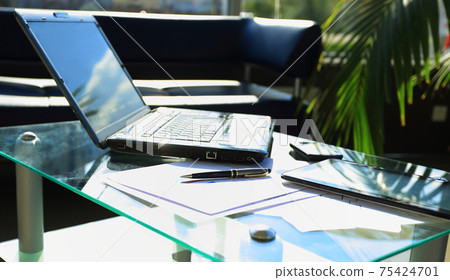 Closeup photo of laptop computer with open top. Blank screen 75424701