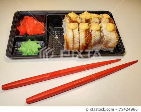 Sushi rolls are Packed in plastic packaging close-up on an isolated background Sushi rolls are Packed in plastic packaging close-up on an isolated background 75424966