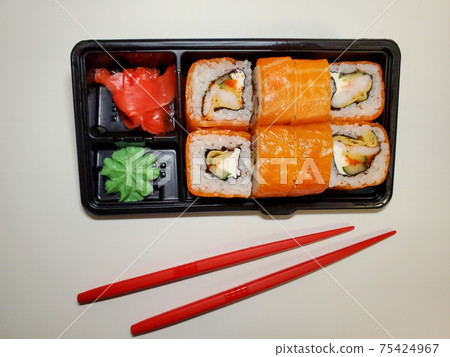 takeaway Lunch, delivery of sushi menu in lunch boxes. The concept of delivery takeaway Lunch, delivery of sushi menu in lunch boxes. The concept of delivery 75424967
